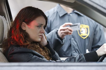 Young Woman Being Pulled Over